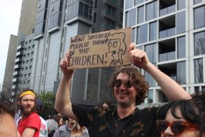 Climate strike in Melbourne, AUS. Person holding sign with Simpson's quote "Won't somebody please think of the children!"